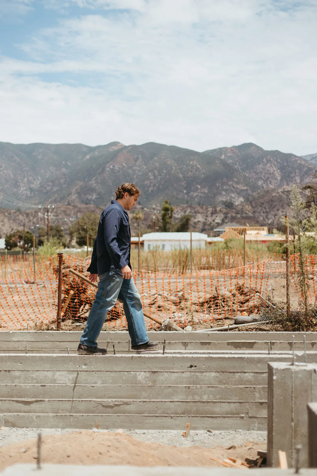 Simon walking a newly poured foundation in Altadena