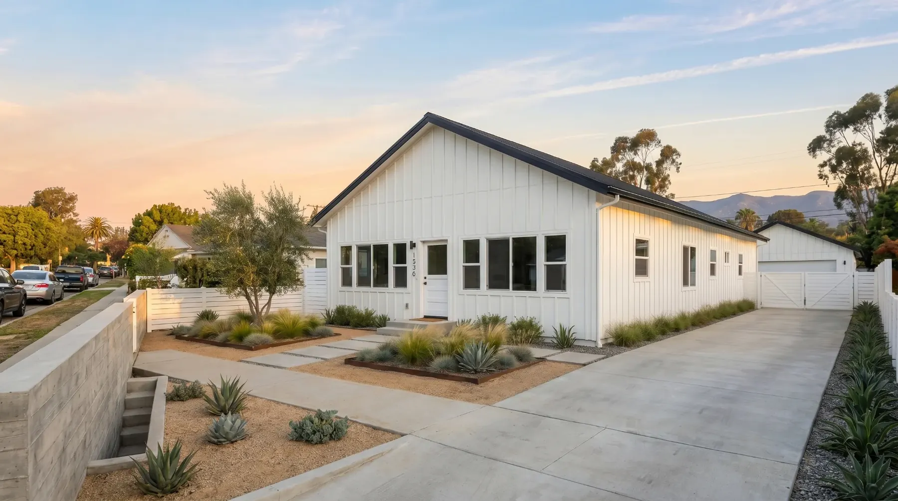 A home rebuilt by Alto Builders at golden hour